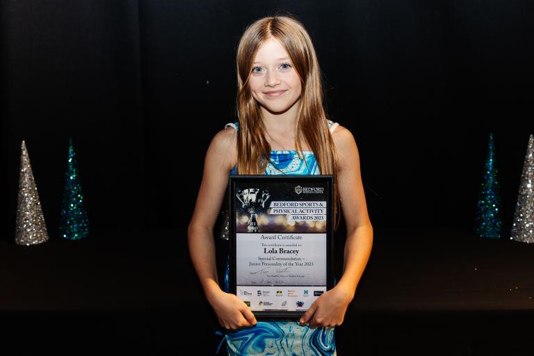Lola Bracey with award