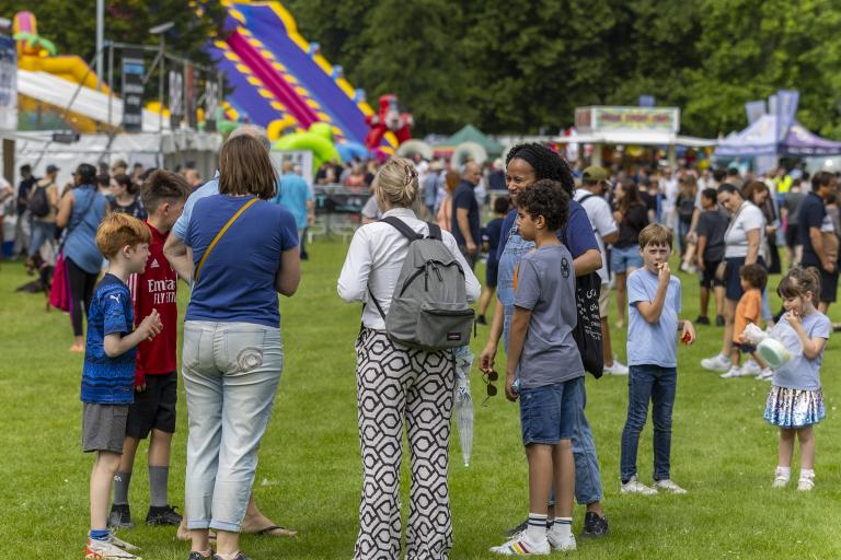 Group of adults and children in park