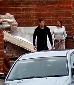 A man and a woman walking
