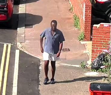 Male walking on road