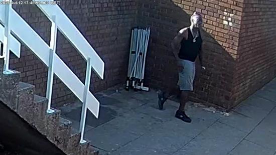 Male walking on pavement