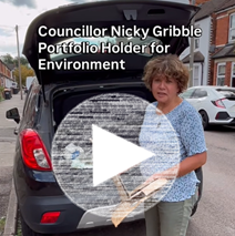 Councillor Nicola Gribble standing in front of car with an open boot with large arrow over image to show it is a still from a video