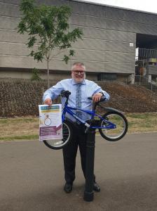 Mayor Dave Hodgson with a donated bike.