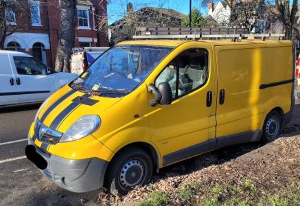 A yellow van abandoned on a street in Bedford Borough
