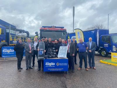 Gibbs & Dandy and Bedfordshire Fire and Rescue Service representatives in front of vehicles from each organisation