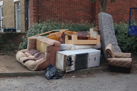 Fly-tipping furniture, a mattress, and a fridge