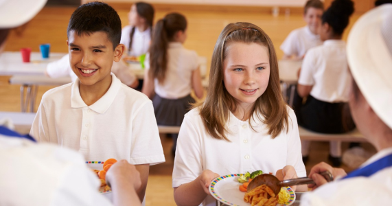 Children being served school lunches.
