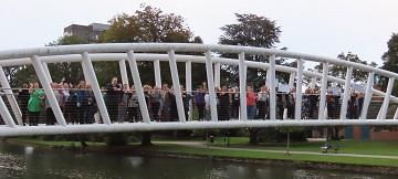 A group of people standing on Bedford's Butterfly Bridge