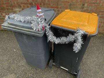 Bins with tinsel and elf