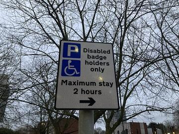 A disabled parking sign