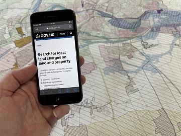 Mobile phone showing an online search for local land charges