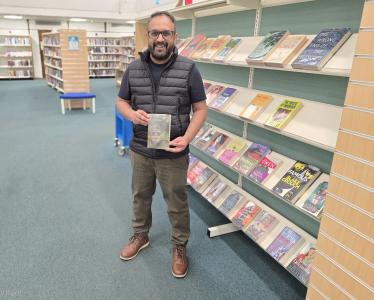 Councillor Abu Sultan with The God of Small Things by Arundhati Roy