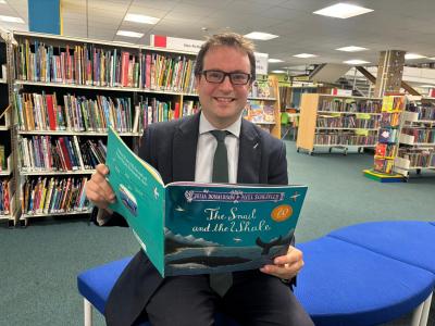 Councillor Henry Vann with a copy of The Snail and the Whale