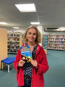 Lucy Bywater with her Year of Reading book