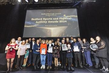 Winners holding their trophies at Bedford Borough Sports and Physical Activity Awards 2024