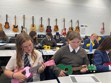 Children playing ukuleles