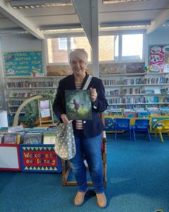 Councillor Caroline White with a copy of Our Tower