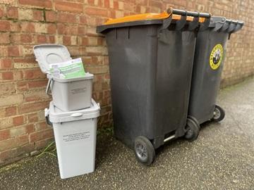 Food waste bin and caddy next to other wheelie bins