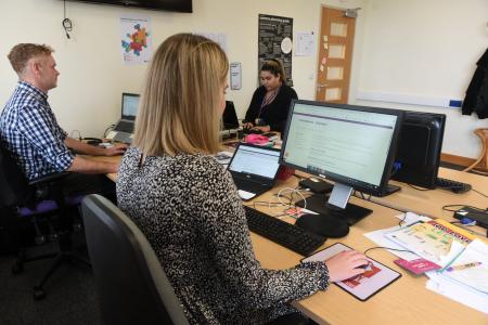 Generic image of people at a computer