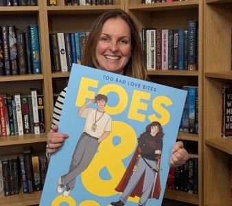 Georgia Bowers with a (giant-sized) edition of her book