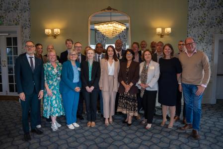Mayor Tom Wootton and chief executive Laura Church with fellow council leaders and government staff at a Universal summit