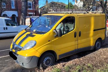 A yellow van abandoned on a street in Bedford Borough