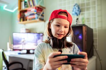 Stock image of a young person gaming