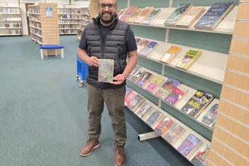 Councillor Abu Sultan with The God of Small Things by Arundhati Roy