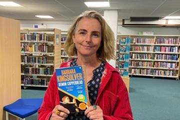 Lucy Bywater with her Year of Reading book