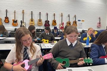 Children playing ukuleles