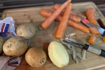 Potatoes and carrots on a chopping board