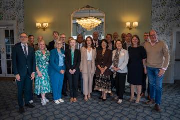 Mayor Tom Wootton and chief executive Laura Church with fellow council leaders and government staff at a Universal summit
