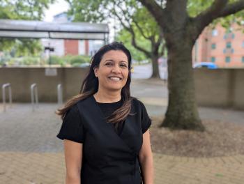 Woman standing in front of tree