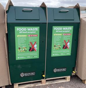 Two large green containers for food waste